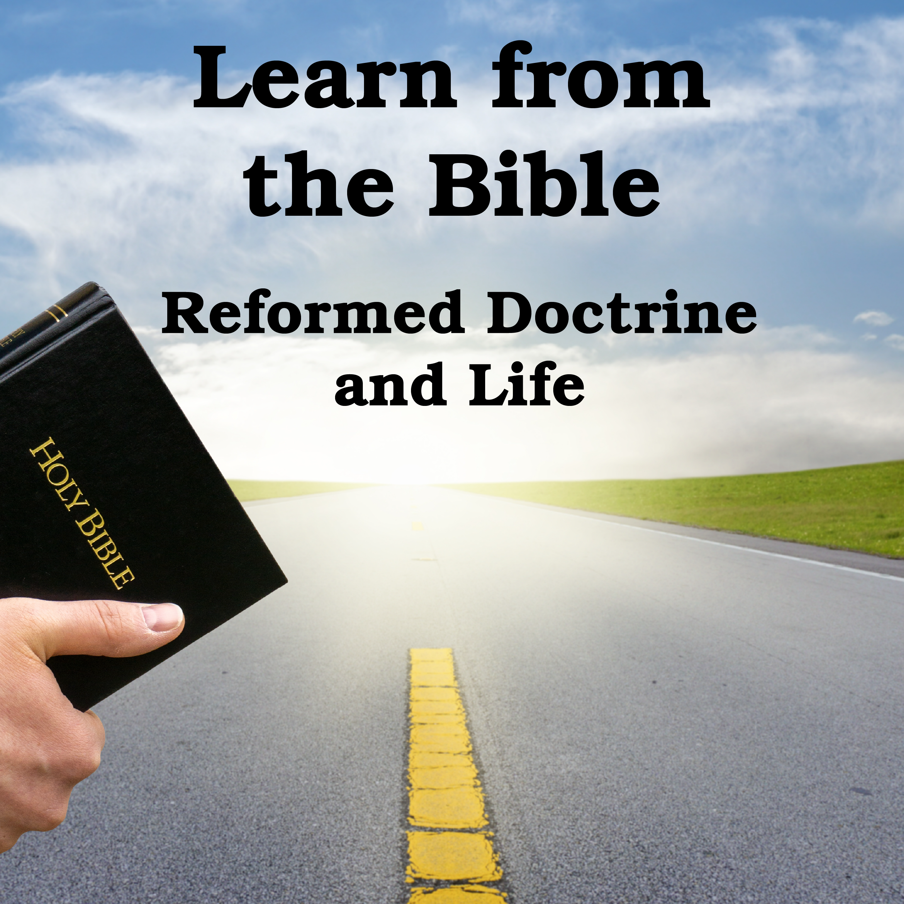 Man holding Bible near road with light at the end